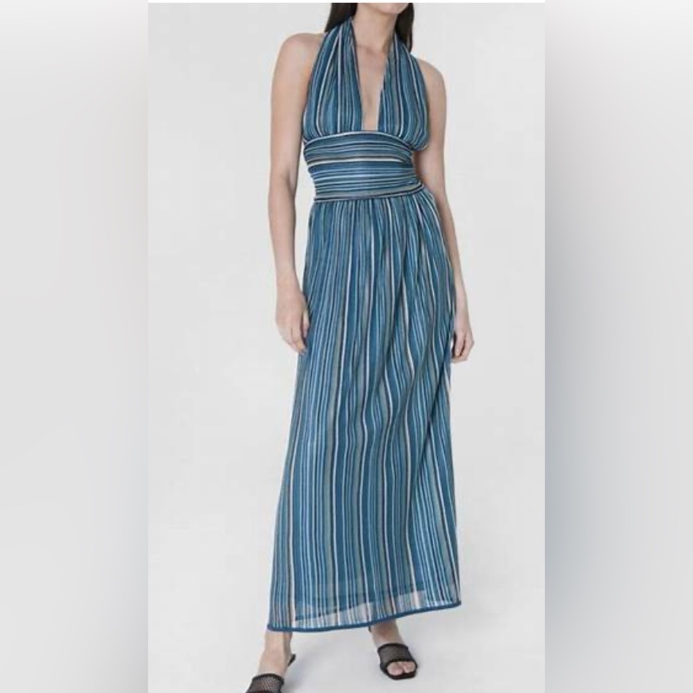 Isla twisted halter dress with open back with maxi, relaxed skirt.